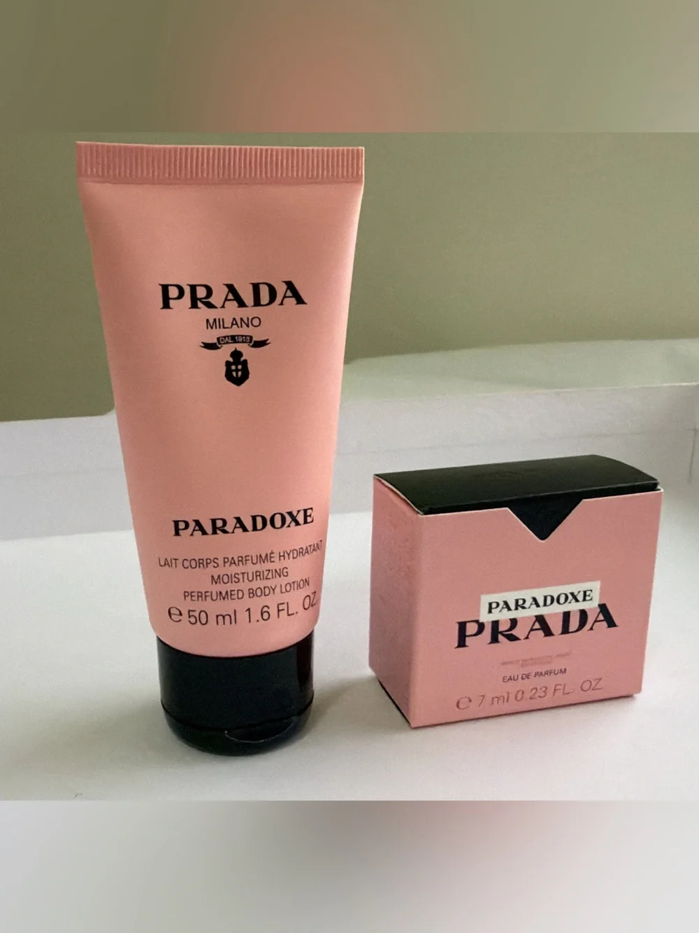 New,unused authentic Prada Paradoxe Pink Body Lotionn$ with Mini Fragrancee3 Set
